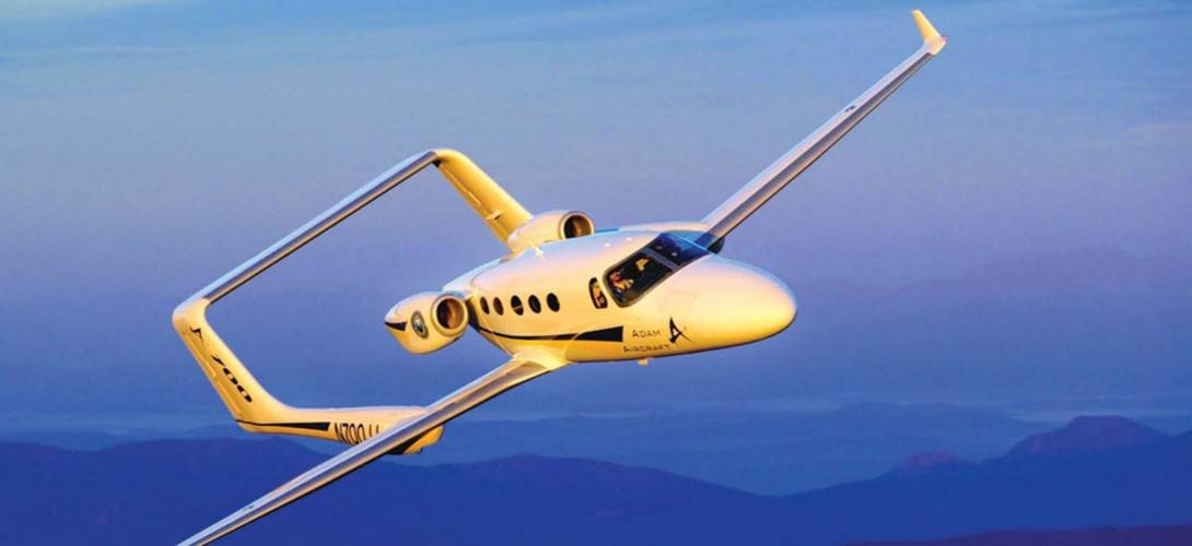 The Adam A 700 light business jet, a brainchild of Adam Aircraft Industries, emerged as a promising entrant in the world of very light aircraft in 2003. Its development was a result of innovative engineering, aiming to offer a higher level of convenience and performance in the realm of light business jets. However, despite its potential, the project faced numerous challenges, ultimately coming to an end in 2009.     At the time, the hot, very light jet market (VLJ) included the Eclipse 500, developed by Eclipse Aviation. The Cessna Citation Mustang, developed by Cessna, and the Diamond D-Jet, developed by Diamond Aircraft. Honda also entered the VLJ market with its HondaJet, which featured an unusual twin-pylon design. Another VLJ that was announced at the time was the Epic Twinjet. Some other small jets, such as the Avocet, the Maverick, and the Safire, were also being developed, but they fell by the wayside.  The very light jet (VLJ) era began in the early 2000s, with several companies developing small jets designed for single-pilot operation and seating for 4-8 passengers. These aircraft were designed to offer a more affordable private jet travel option and compete with larger business jets. However, not all of these VLJs made it to market, and some companies faced financial difficulties during development. The VLJ market has continued to evolve since then, with new models and designs being introduced.  The prototype A700 made its first flight on July 28, 2003. The Adam A 700 AdamJet was conceptualized as a six-seat civil utility aircraft. Adam Aircraft Industries initiated its development in 2003 with the intention to create a jet-powered version of their piston-engined Adam A500. The A700's design incorporated approximately 80% commonality with the A500, including the central fuselage, twin wing-mounted booms, and the high horizontal stabilizer. The Adam A 700 was equipped with an Avidyne Entegra glass cockpit, offering pilots a modern and intuitive interface.     The power source was the most significant difference between the A700 and its predecessor. While the A500 relied on piston engines, the A700 was powered by two Williams FJ33 turbofans. These engines were mounted on the sides of the fuselage, unlike the centerline thrust arrangement in the A500. Consequently, the forward fuselage was extended by 4 feet to balance the twin rear-mounted engines.  However, the path toward realizing the Adam A 700 was challenging. On February 11, 2008, Adam Aircraft ceased operations, and on February 19, 2008, the company filed for Chapter 7 bankruptcy. This led to the development of the A700 coming to a halt, with no production models being certified or delivered.  In April 2008, AAI Acquisition Inc purchased Adam Aircraft from bankruptcy. The new owners expressed their intent to continue with the certification of the A700. This action led to the resumption of work on the A700 in May 2008 by Industrial Investments, the Russian company that purchased Adam Aircraft. Although the company initially intended to certify the A700 by the first quarter of 2010, the economic crisis of 2008 led to the suspension of development activities.  Interestingly, the Federal Aviation Administration accepted the previous certification data recorded by Adam Aircraft. This move would have significantly simplified certification efforts by the new company. However, in April 2009, Adam Aircraft again ceased operations and laid off all its staff, marking the end of the A700's development.   In April 2011, Triton Aerospace, the new holder of the type certificate, indicated that they would focus on the A500 and had yet to make plans to continue the development of the A700, even though they had two disassembled examples.   Despite its untimely end, the Adam A 700 remains a remarkable example of innovation in light business jets. Its unique design, use of cutting-edge technology, and the ambitious vision driving its creation continues to inspire the aviation industry. The Adam A 700 light business jet may have yet to realize its full potential, but its legacy continues to influence future aircraft design and development.   Adam A 700 Specifications General Characteristics    Crew  One or two pilots  Capacity  Four to six passengers, depending on cabin configuration  Length  40 ft 9 in (12.42 m)  Wingspan  44 ft 0 in (13.41 m)  Height  9 ft 7 in (2.92 m)  Airfoil  NASA LS(1)-0417  Empty weight  5,550 lb (2,517 kg)  Max takeoff weight  9,350 lb (4,241 kg)  Powerplant  2 × Williams FJ33-4A turbofan engine, 1,350 lbf (6.0 kN) thrust each  Performance Performance    Maximum speed  382 mph (615 km/h, 332 kn)  Stall speed  73 mph (117 km/h, 63 kn)  Range  1,611 mi (2,593 km, 1,400 nmi)  Service ceiling  41,000 ft (12,000 m)  Rate of climb  2,550 ft/min (13.0 m/s)   